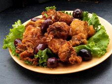 Fried, breaded squid with olives