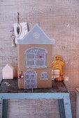 A homemade paper house and a bread man for Christmas