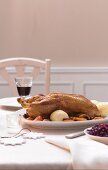 A whole duck with dried fruit and red cabbage