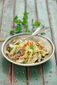 Tagliatelle with strips of salami and a mushroom sauce