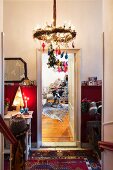 Red wall panelling and Christmas decorations in colourful hallway