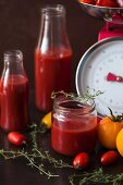 Sieved tomatoes in a jar and bottles