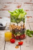 A layered chickpea salad in a jar