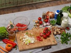Chopped vegetables and ingredients for vegetarian dishes on a grey platter