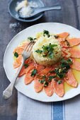 Salmon trout slices with a herb and lemon sauce with rice