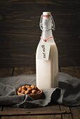 Hazelnut milk in a glass bottle