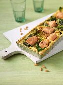 Salmon bake with spinach and pine nuts