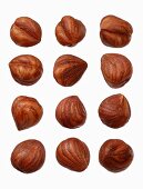 Twelve hazelnuts on a wooden surface