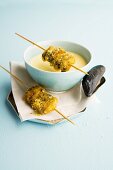 Crispy mussel skewers with mussel and cinnamon soup