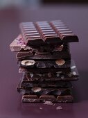 A stack of different bars of chocolate