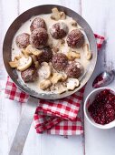 Köttbullar (Swedish meatballs) with a mushroom sauce and lingonberries