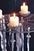 An Advent wreath made from a round kitchen rack and baking tins