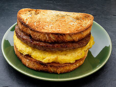 A toasted sandwich with sausage and egg for breakfast (USA)
