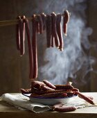 Sausages in a smoking chamber
