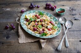 Cauliflower salad with red grapes, parsley and pul biber