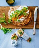 Buckwheat pancakes topped with cream cheese and smoked salmon