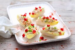 Chicory boats with cream cheese and pomegranate seeds