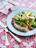 Pork chop with pesto and broccoli