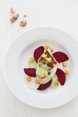 Branzini on roasted beetroot with wasabi sauce and celery croutons
