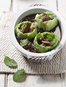 Clear broth with white cabbage, meatballs and mushrooms