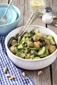 Potato salad with new potatoes, courgettes, olives, almonds and pesto
