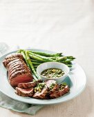 Roast beef with green asparagus and green sauce