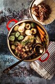 Coq au vin with barley and spinach dumplings