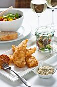 Battered fish with salad and tartare sauce