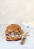 Sliced banana bread with blueberries and chocolate