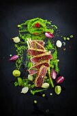 Flash-fried tuna fish with limes, onions, chilli and wasabi (seen from above)