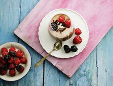 Banana and chocolate ice cream with berries