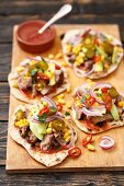 Homemade tortillas with pork, avocado, sweetcorn, red onions and chilli peppers
