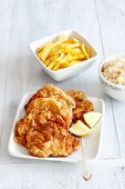 Pork escalopes with chips and steamed cabbage