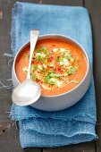 Cream of tomato and lentil soup with celery leaves