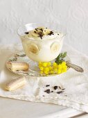 Banana pudding with sponge fingers in a glass bowl