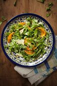 Rocket salad with persimmon and Parmesan cheese