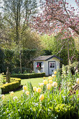 Small playhouse in spring garden