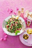 Bulgur salad with pomegranate seeds, herbs and broccoli (Arabia)