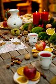 A table laid for advent with tea and baked apples at the Kittenberger Adventure Garden in Schiltern