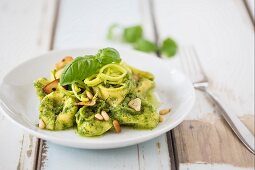 Tortellini with pesto, leek and pine nuts