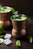 Cocktails made with ginger beer, vodka, limes, cucumber and mint