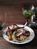 Aubergine chips with sesame seeds, and glazed ribs with spring onions