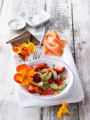 Vegan avocado and strawberry salad with nasturtiums