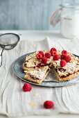 raspberry tart with almonds, sliced