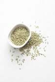 Fennel seeds in a bowl and next to it