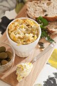 Artichoke paste with Parmesan, mayonnaise and sour cream served with olives and bread