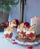 Baumkuchen (German layer cake) and cherry trifle in desert glasses for Christmas