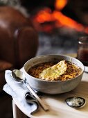Bacon and onion soup au gratin with cheese