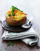 A baked potato filled with cheese and chives