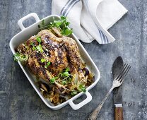 Roast chicken with pine nuts and water cress